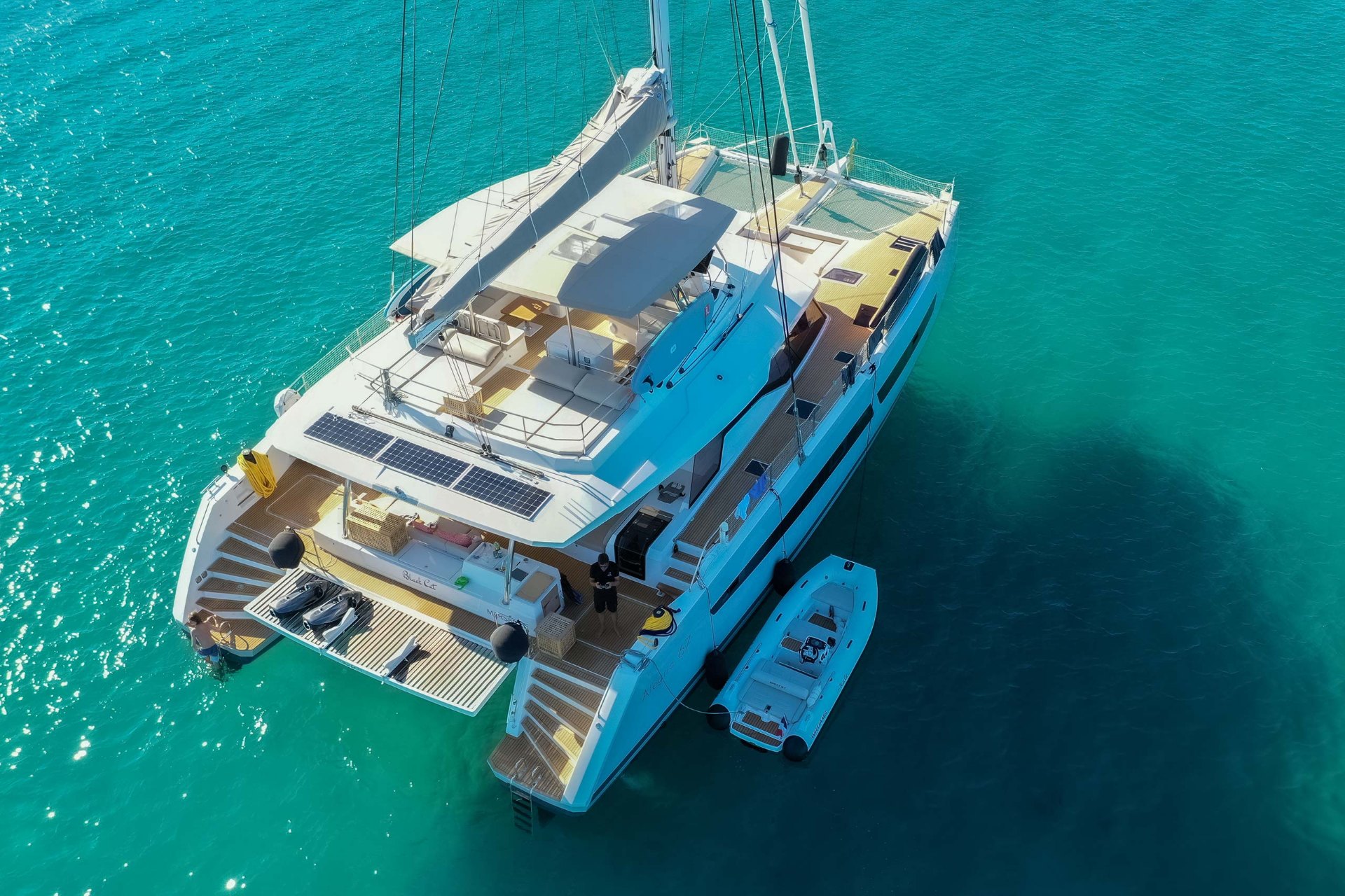 Luxury catamaran sailing at golden hour